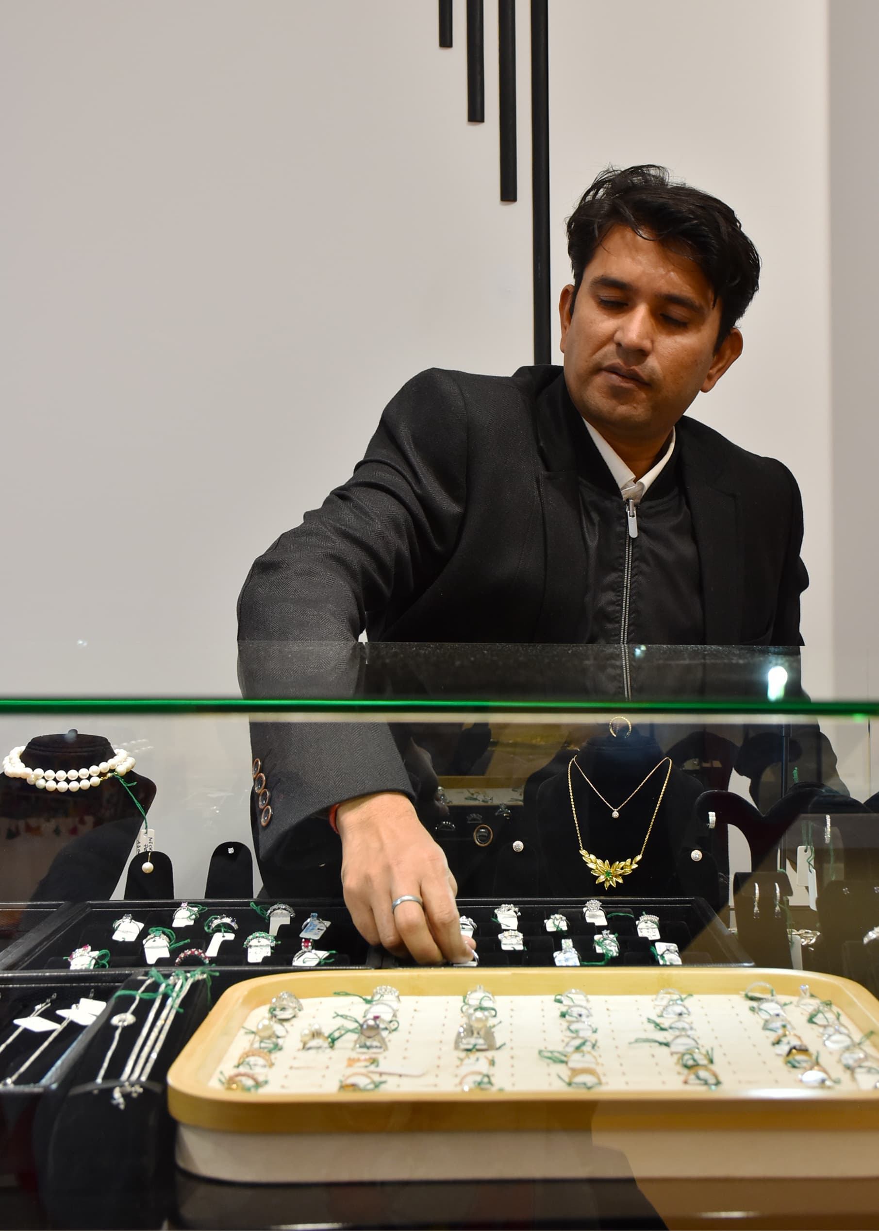 Raj Namdev selecting rings in the shop